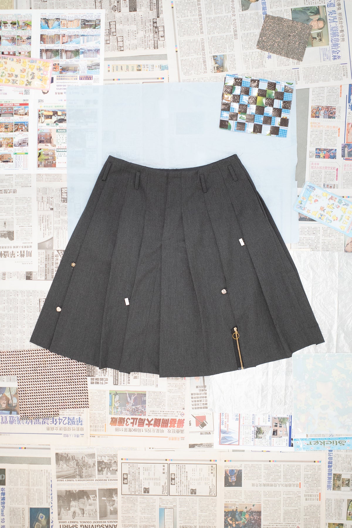 Pleated Skirt with Button and Zipper Detail